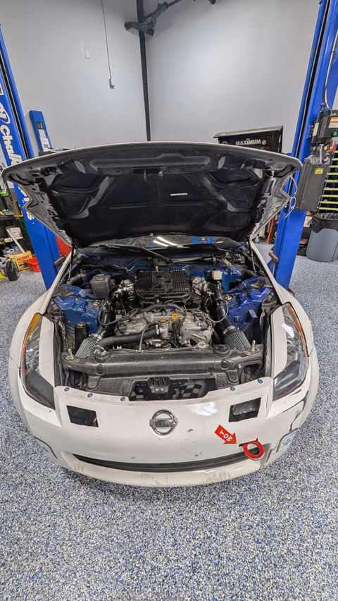 Plan Z Motorsports' white 2003 Nissan 350Z in the garage