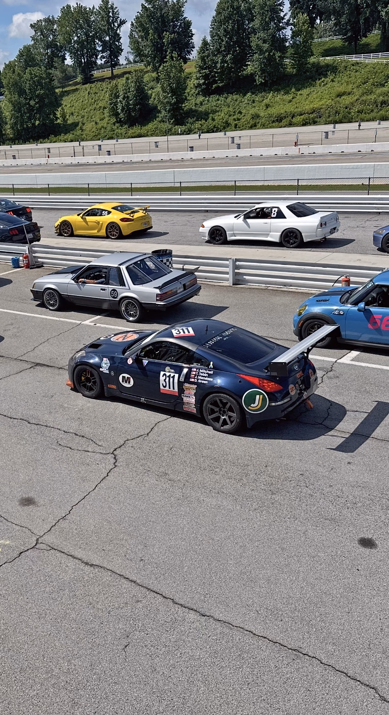 Plan Z Motorsports' dark blue 2007 Nissan 350Z on the starting line