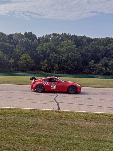 The red 2011 Nissan 370Z race car